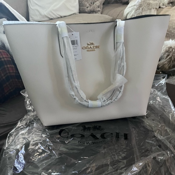 Coach bag brand new Color is described as chalk with a blue interior